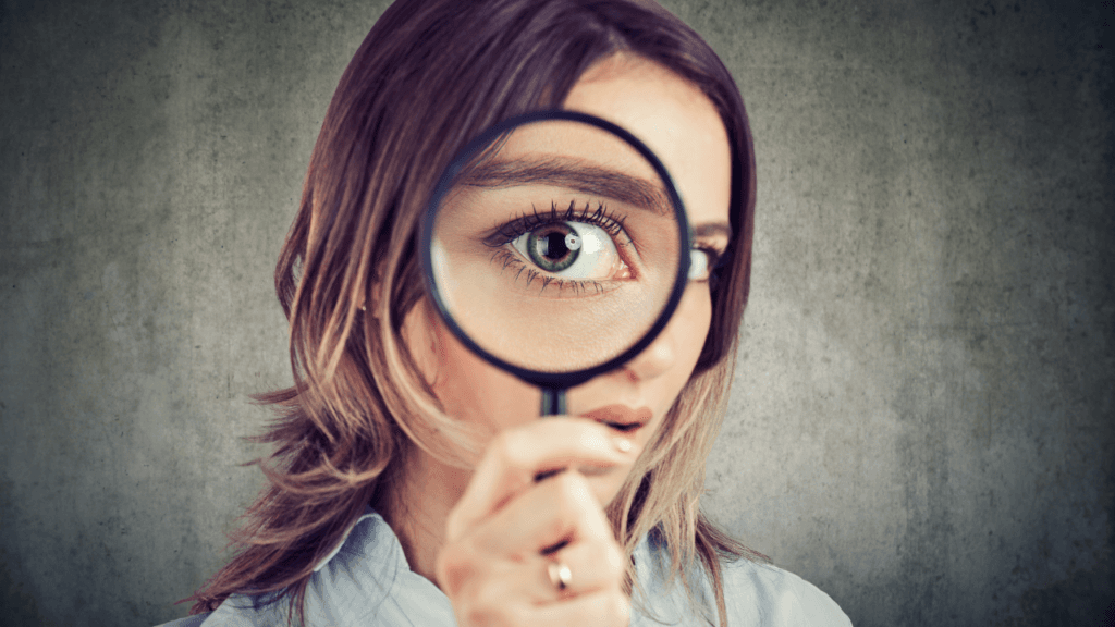 Woman with magnifying glass